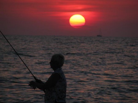 Fishing at sunset on Sunset Beach, Treasure Island, Florida