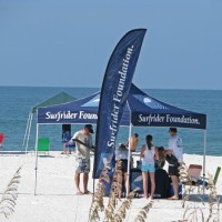 Surfrider’s Upham Beach Cleanup Suncoast Surfrider tent with members on Upham Beach.