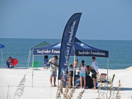 Suncoast Surfrider tent with members on Upham Beach.