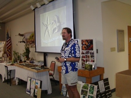 Blair Witherington talks about Florida beachcombing at the International Seabean Symposium. Photo provided by Marge Bell of spacecoastbeachbuzz.blogspot.com.