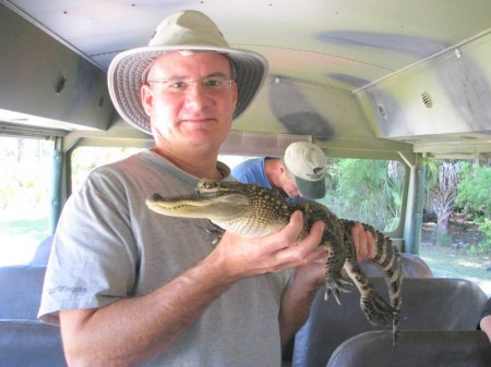 Holding a live baby 'gator on the Babcock Wilderness tour bus. 