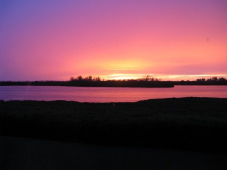 The sun sets over Perico Bay in Bradenton, Florida. Photo copyright Lisa W.