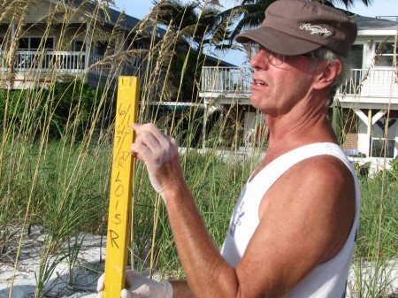 IMG_4510 Ed explains what the numbers and letter stand for on the nest markers. These markers are helpful in keeping track of the nest location and the expected hatch date.