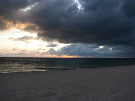 IMG_4836 We drove out to the beach under clear skies, but by the time we arrived, a dissipating cumulonimbus over Tampa Bay suddenly shifted and moved rapidly to the west, threatened our sunset.
