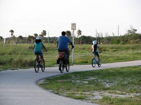 family riding bikes at Fort Desoto Park