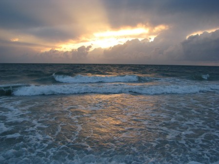 Cloudy sunset with crepuscular rays over the Gulf of Mexico