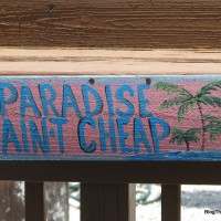 Paradise Ain't Cheap sign