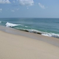 Sebastian Inlet has powerful surf pounding onto the sand and shells.