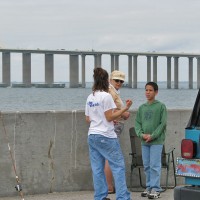 Liz talks to fishermen, educating them about helping injured birds.