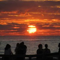 Honeymoon Island and the Pinellas Trail The sun sets with a wedding party silhouetted against the Gulf of Mexico at the main beach on Honeymoon Island.
