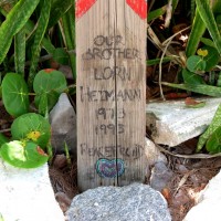 A Cross on the Beach for Lorn The cross has an inscription on the bottom: "Our Brother Lorn Heimann 1973-1993"